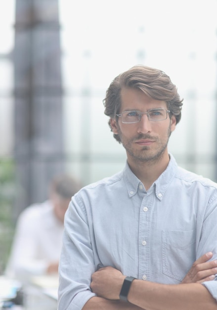 Closeup portrait of a young successful businessman in the office