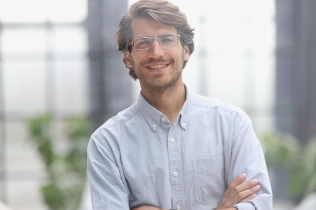 Closeup portrait of a young successful businessman in the office