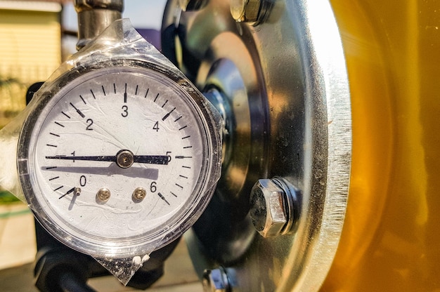 Closeup of a pressure gauge for measuring installed in water or gas supply systems Plumbing equipment