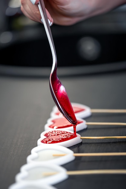 Closeup the process of making lollipops from natural ingredients