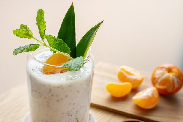 Closeup of pudding from chia seeds and yogurt or milk with clementine