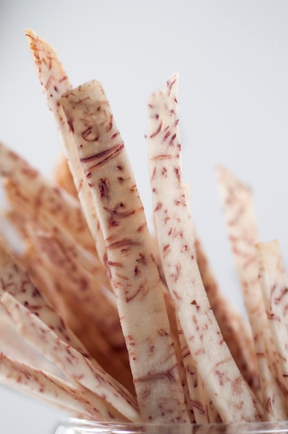 Closeup purple and white taro strips white background taro