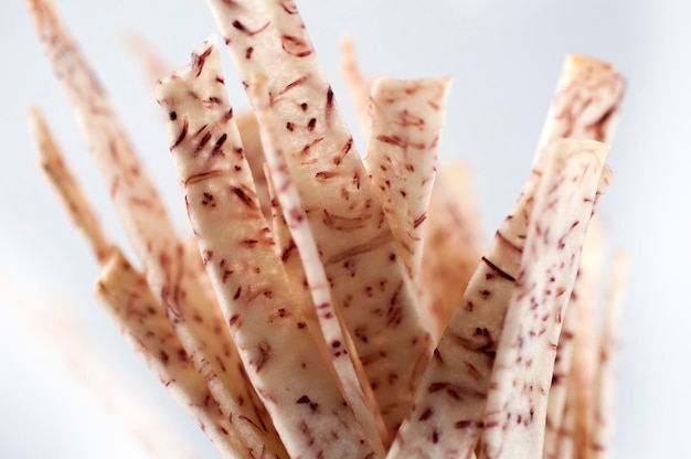 Closeup purple and white taro strips white background taro