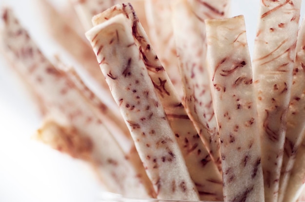 Closeup purple and white taro strips white background taro