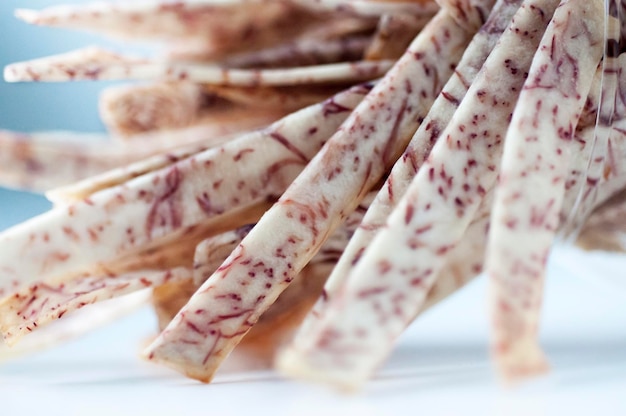 Closeup purple and white taro strips white background taro