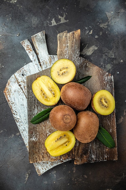 Closeup ripe golden kiwi fruit Food background vertical image top view place for text