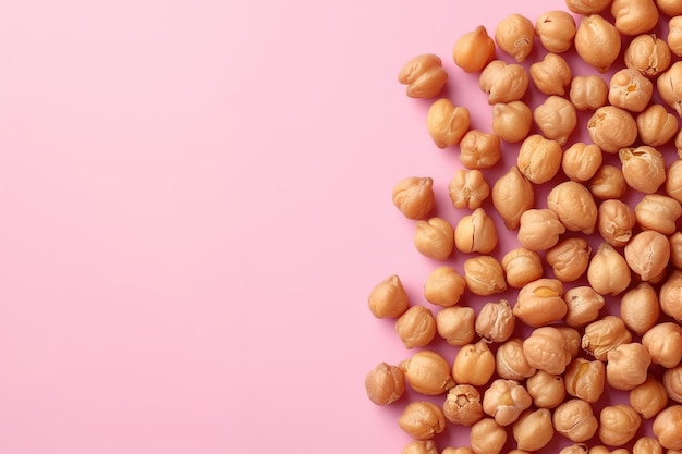 Closeup of roasted chickpeas on a soft pink background showcasing snacks and plant based protein