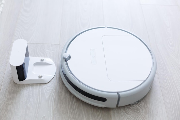 closeup robotic vacuum cleaner over white background