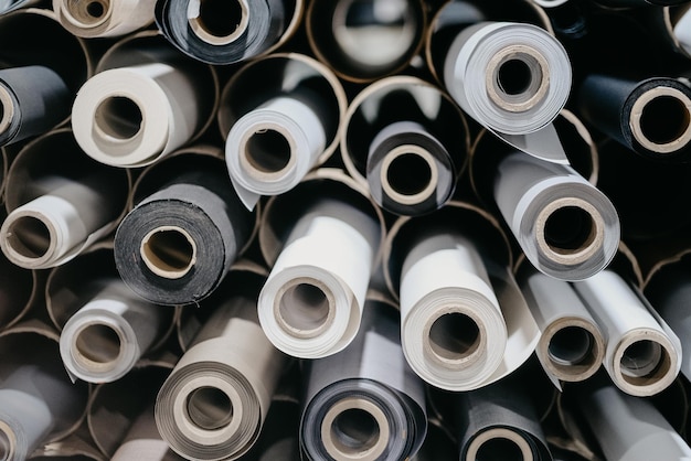 Closeup of rolls of textile and fabric for roller blinds in a factory