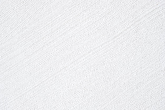 Closeup rough white concrete wall exterior design for texture and background.