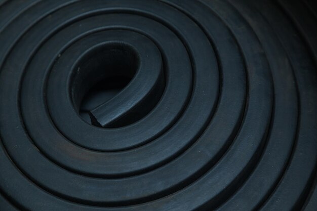 Photo closeup rubber sealing strips for waterproof doors a pile of rubber twisted into rolls