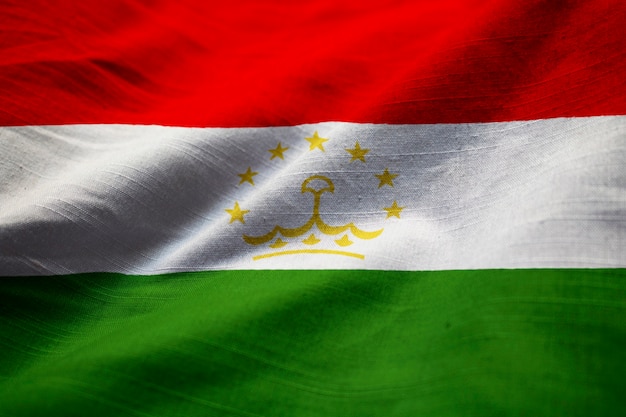 Closeup of Ruffled Tajikistan Flag, Tajikistan Flag Blowing in Wind