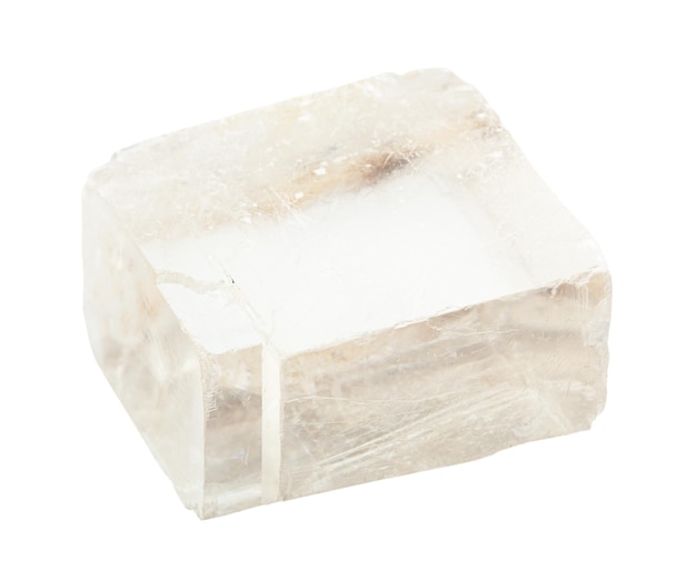 Closeup of sample of natural mineral from geological collection unpolished transparent iceland spar Calcite rock isolated on white background