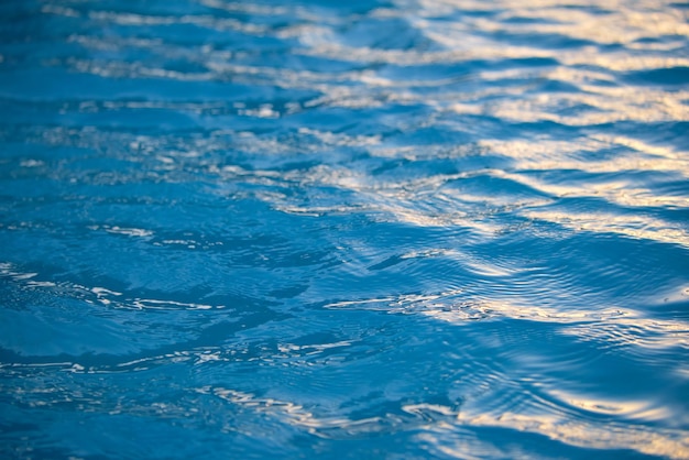 Closeup seascape surface of blue sea water with small ripple waves