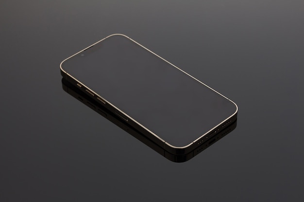 A closeup shot of a black smartphone on a black background. Close up photo of modern smartphone's triple-lens camera, iphone 13 pro. Stylish and essential accessory for your image. Mock up, technology