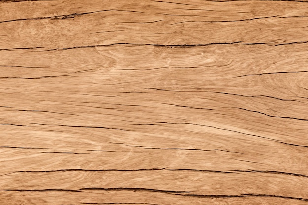 Closeup shot of a brown wooden texture with a natural grain pattern and cracks