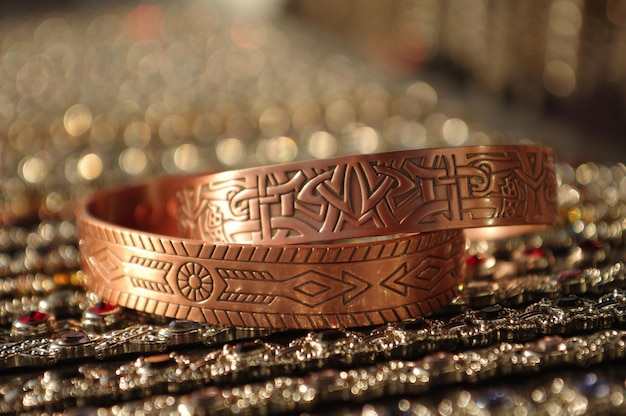 Closeup shot of copper bracelets with patterns