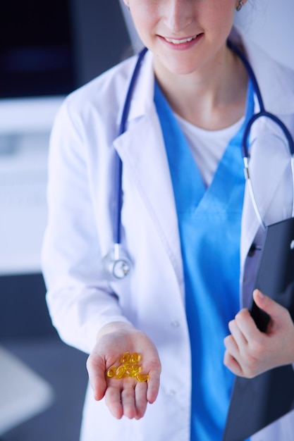 Closeup shot of doctor's hands holding pills