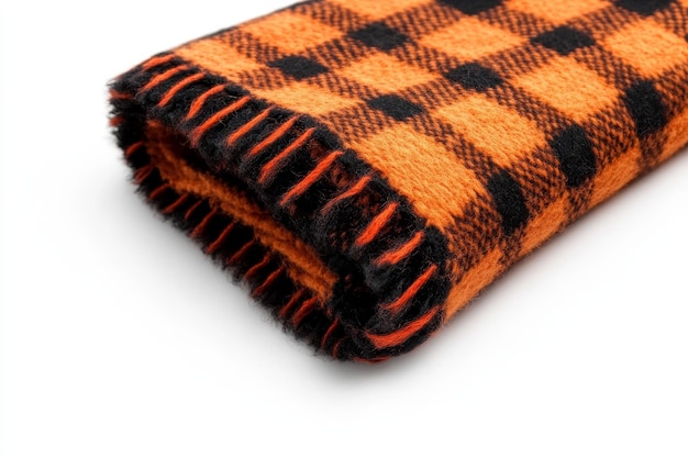 Photo a closeup shot of a folded orange and black plaid blanket with a soft fuzzy texture showcasi