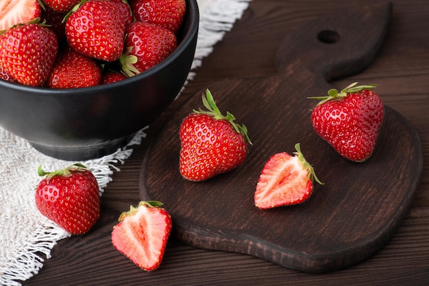 Closeup shot of fresh ripe strawberries Tasty organic berries on black table