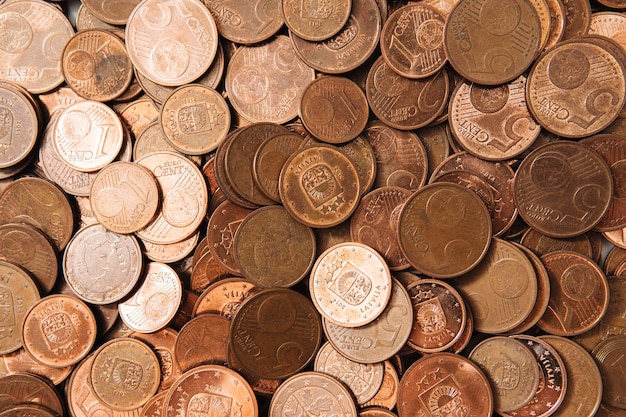 Closeup shot of a large pile of shiny copper euro coins of small value