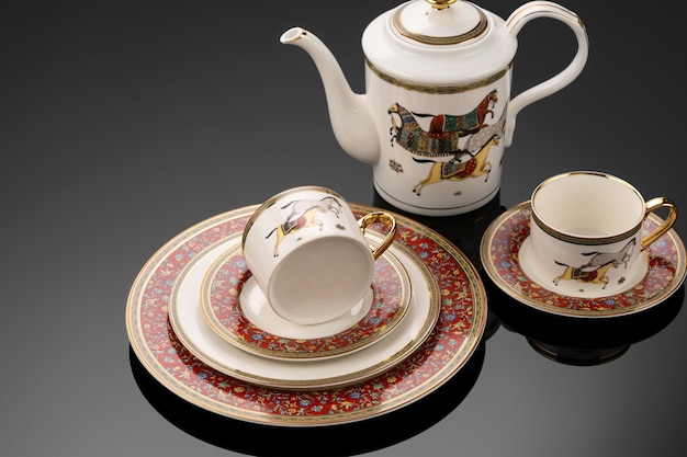 A closeup shot of luxury ceramic tableware isolated on the black background