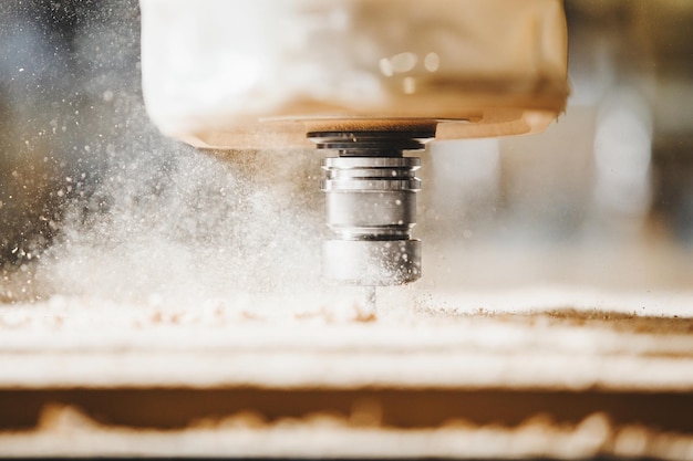 Closeup shot of machine with numerical control cuts wood Cnc tool