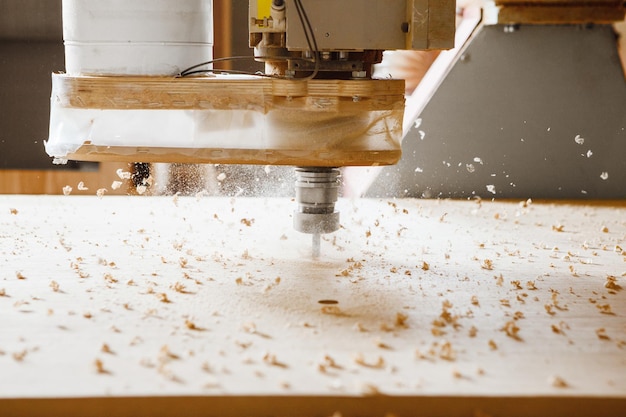 Closeup shot of machine with numerical control cuts wood Cnc tool