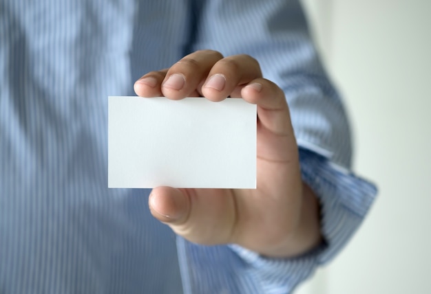 closeup shot  Man show white business card Plastic bank-card design mock up