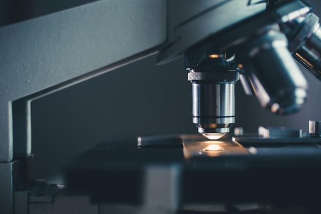 Closeup shot of microscope with metal lens at laboratory