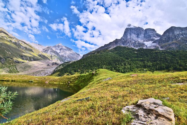 Closeup shot of a mountainous lake with blue sky in the background