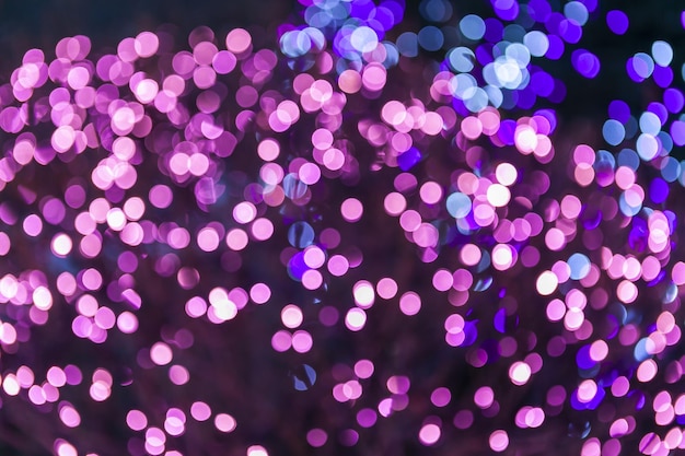 Closeup shot of pink and purple bokeh lights isolated on black background