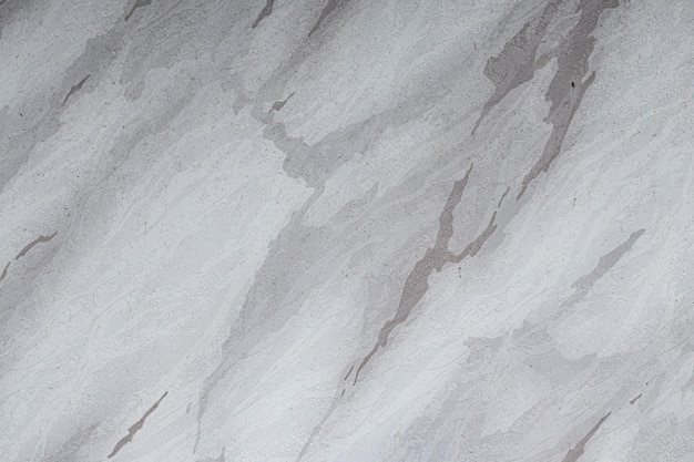 Closeup shot of white and grey volakas marble wallpaper