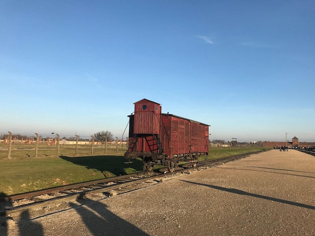 Closeup shot of a wooden barn on a railway in the Auschwitz concentration camp on a sunny day