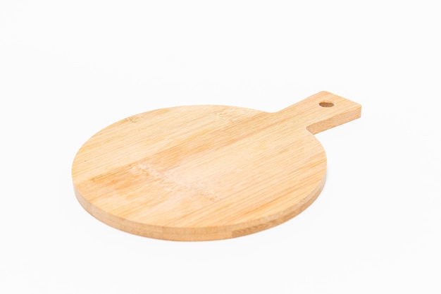 Closeup shot of a wooden chopping board isolated on a white background