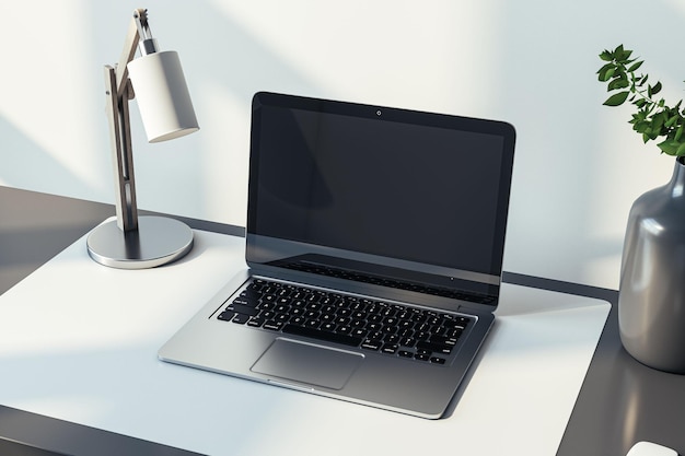 Closeup side view of a home black desk with blank screen modern laptop lamp and homeplant on light wall background in sunny cozy interior mockup Home office and workplace concept 3D Rendering