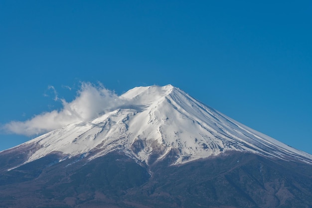 Closeup snow covered Mount Fuji Mt Fuji in clear blue sky background on sunny winter season