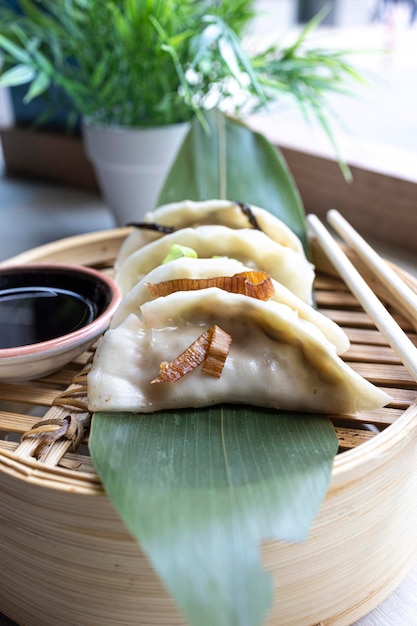 Closeup of some delicious Gyozas Oriental traditional cuisine vertical image