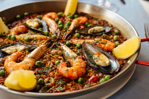 Closeup on spanish national rice dish paella with seafood in a pan