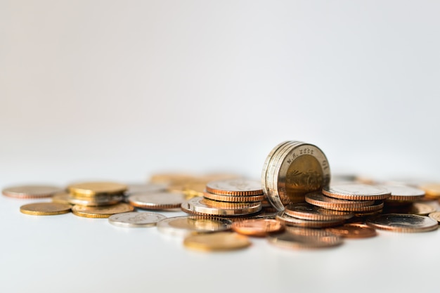 Closeup stack coins on white background 