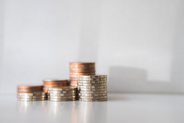 Closeup stack coins with sunlight using as business and financial concept 