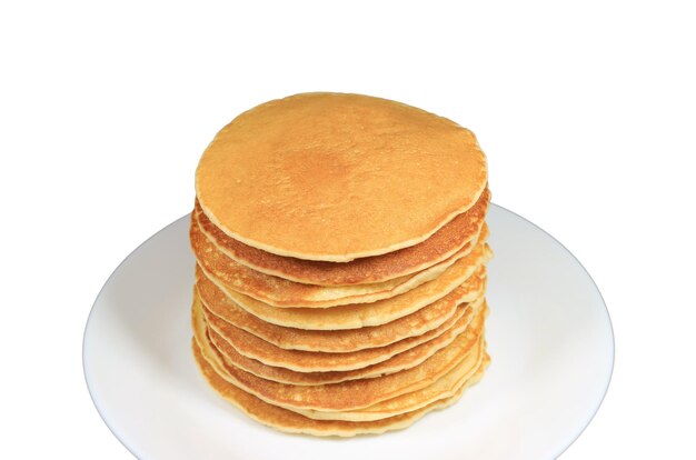 Closeup stack of homemade pancakes on white plate isolated on white background