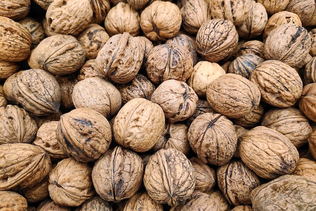 Closeup on a stack of walnuts on a market stall