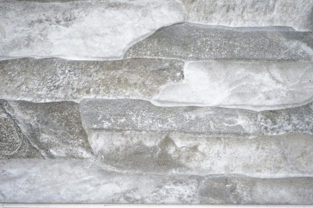 Closeup of stacked old white stones