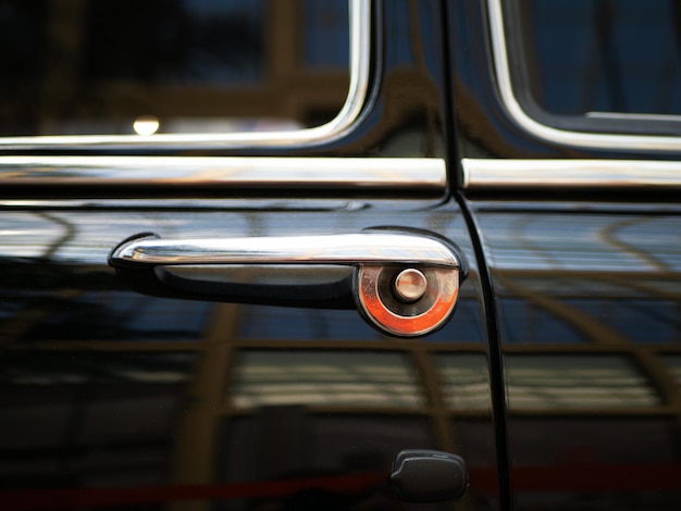 Closeup of a steel chrome handle of an old car