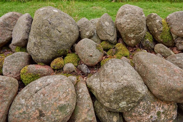 Closeup of a stone wall made of boulders and rocks outside Background of rustic rural building and masonry material Historic housing design or antique architecture of an urban structure outdoors