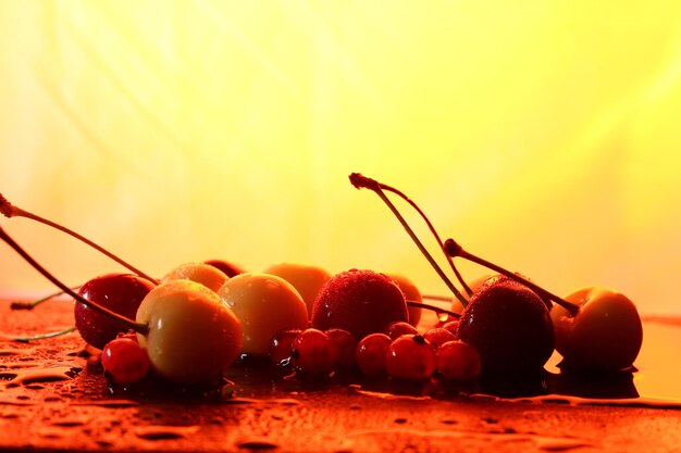 Closeup of sweet berries with drops of water on a dark background Healthy food concept