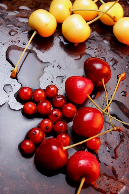 Closeup of sweet berries with drops of water on a dark background Healthy food concept