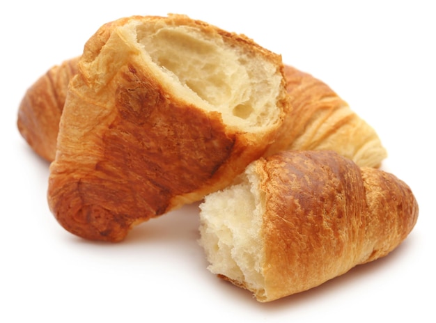 Closeup of tasty croissant over white background