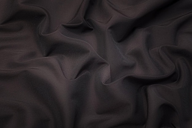 Closeup texture of natural beige fabric or cloth in brown color